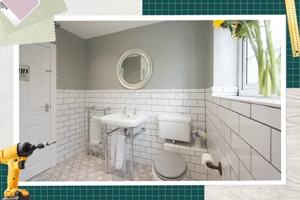 Stylish renovated bathroom with white tiled walls round mirror and modern fixtures